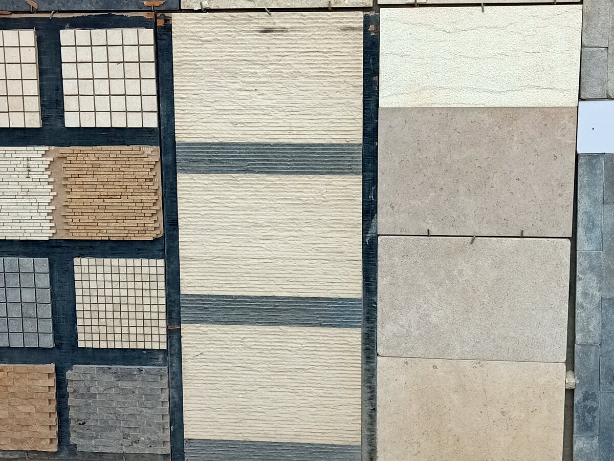 Showroom wall displaying stone tiles, mosaics and textured finishes